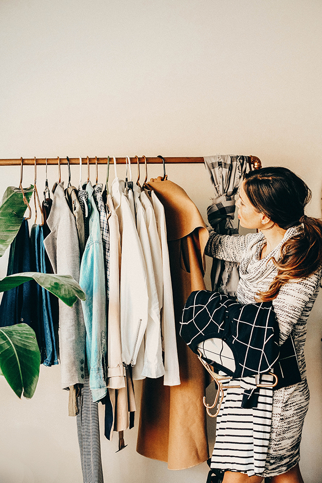 Woman arranging her clothes